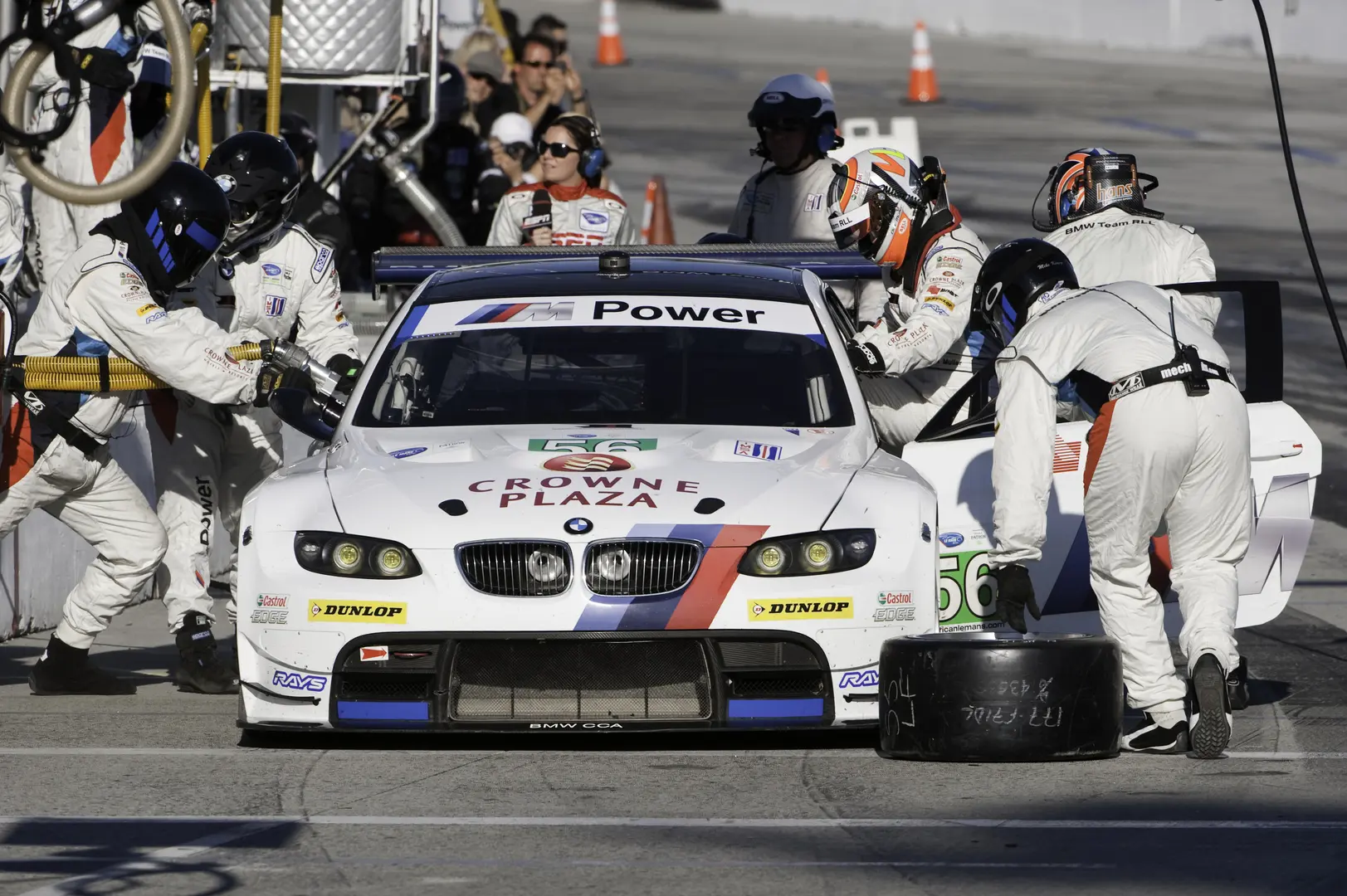 A group of people working on a race car.